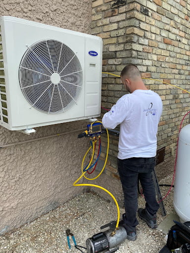 Provincial employee installing air conditioner